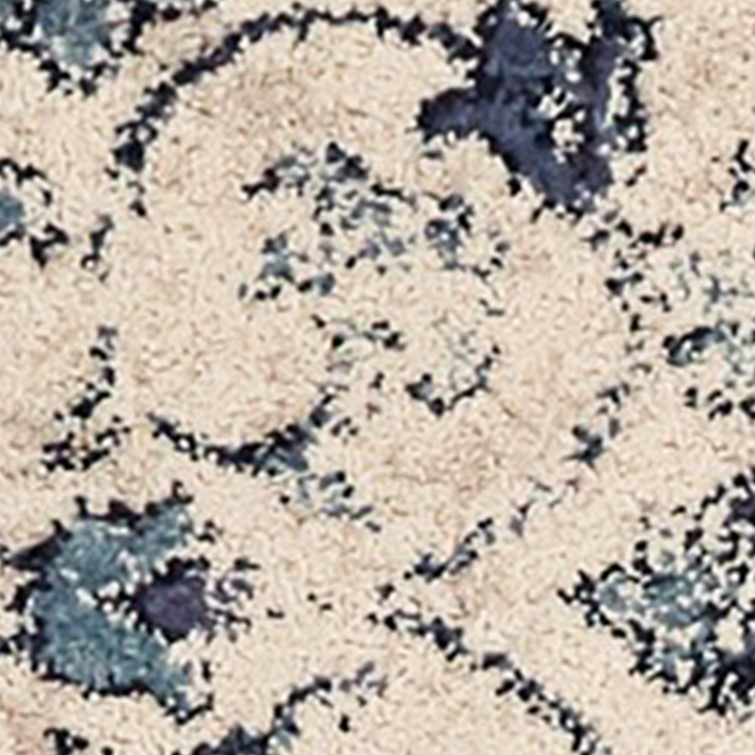 A beautiful 2' x 7' polypropylene area rug in ivory and blue mosaic design, showcasing intricate patterns and a plush texture.