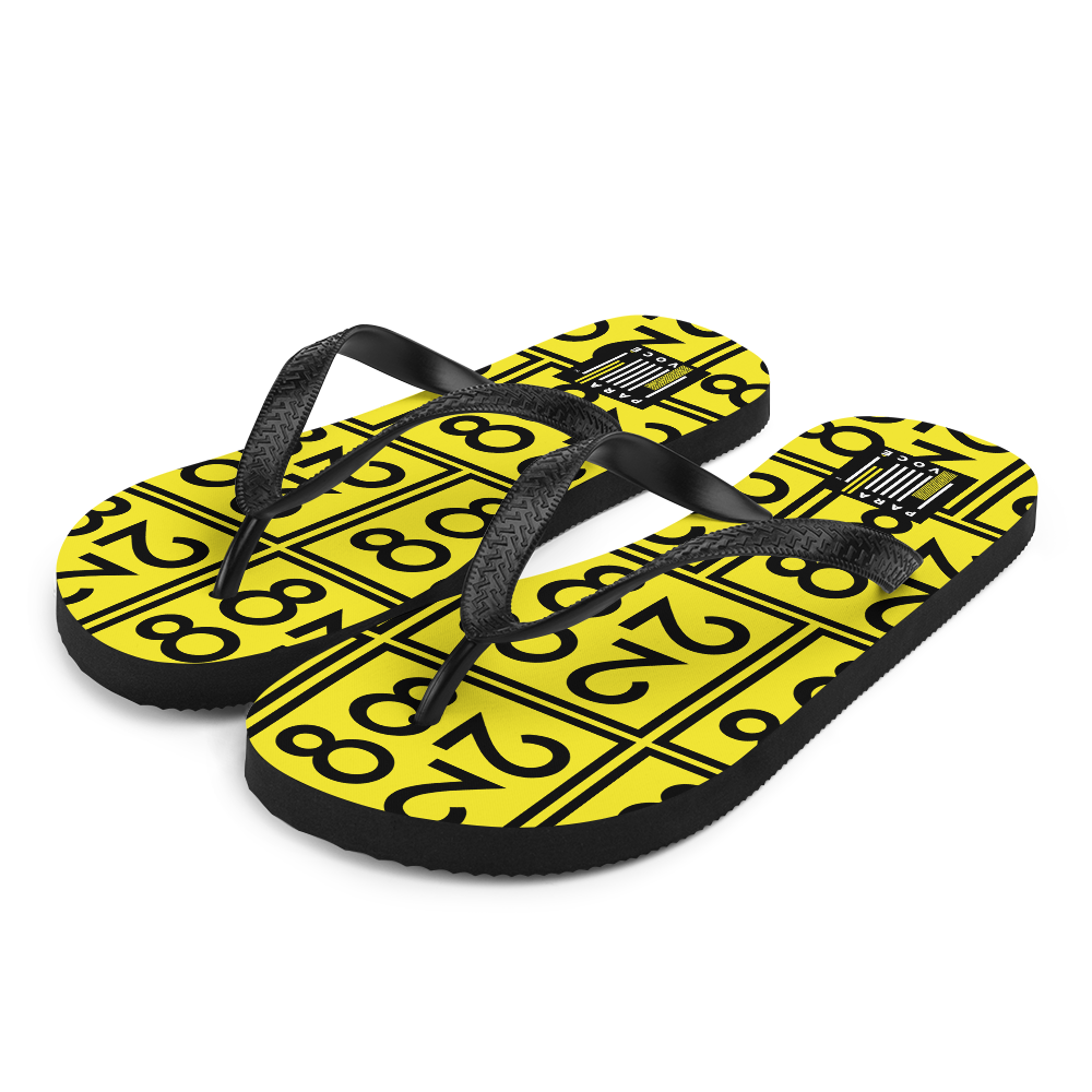 A pair of 2882Sport™ Black and Yellow Flip-Flops featuring a rubber sole and Y-shaped straps, perfect for summer wear.