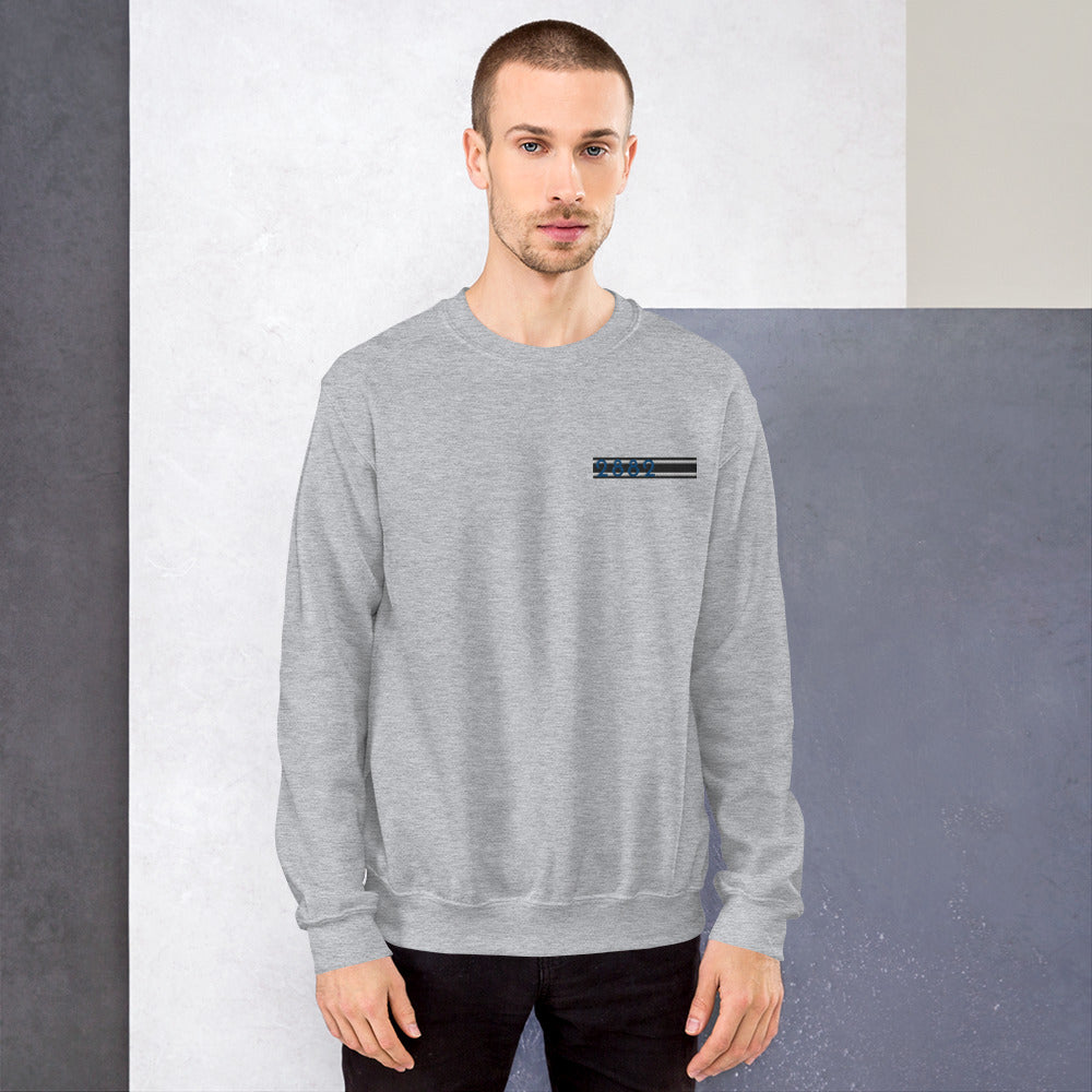 2882Sport™ Tropics Of OZ embroidered sweatshirt in a cozy setting, showcasing its soft fabric and classic fit.