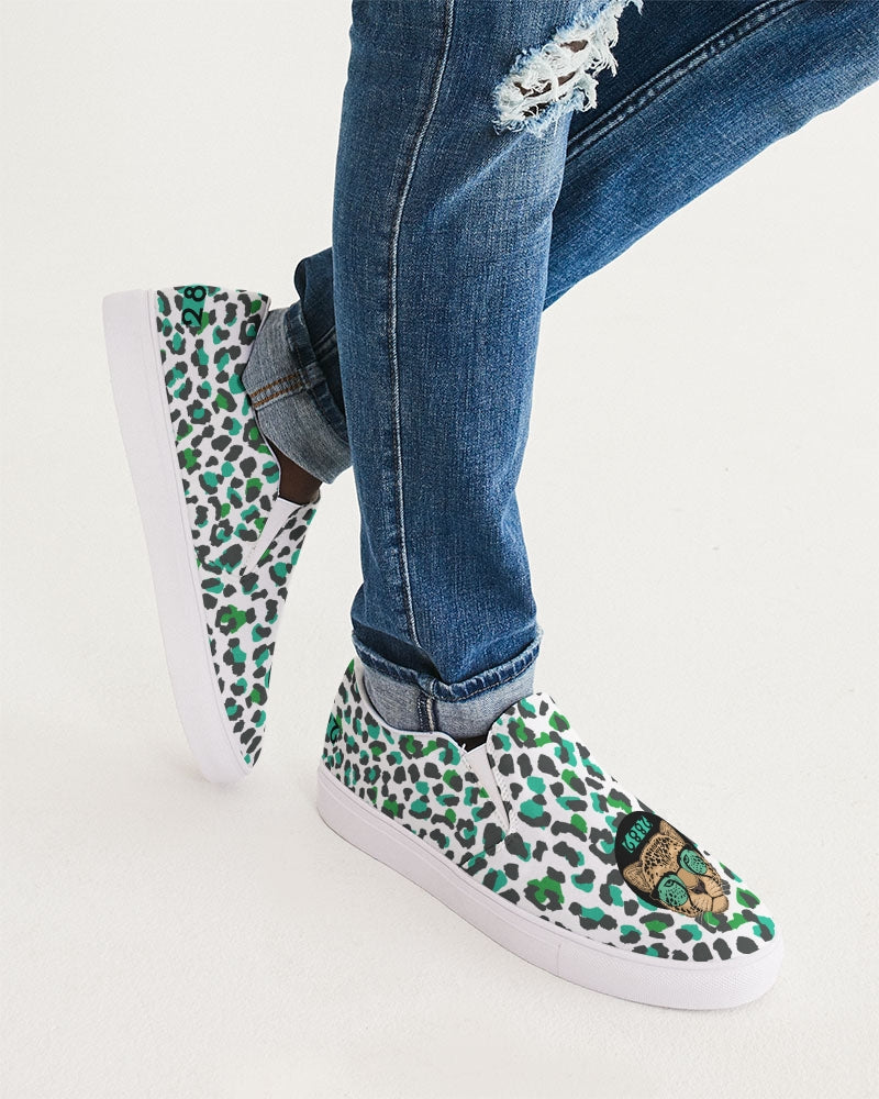 2882Sport™ Tropics of Oz Men's Cheetah Slip-On Canvas Shoes featuring a vibrant cheetah print and Shady Lion graphic.