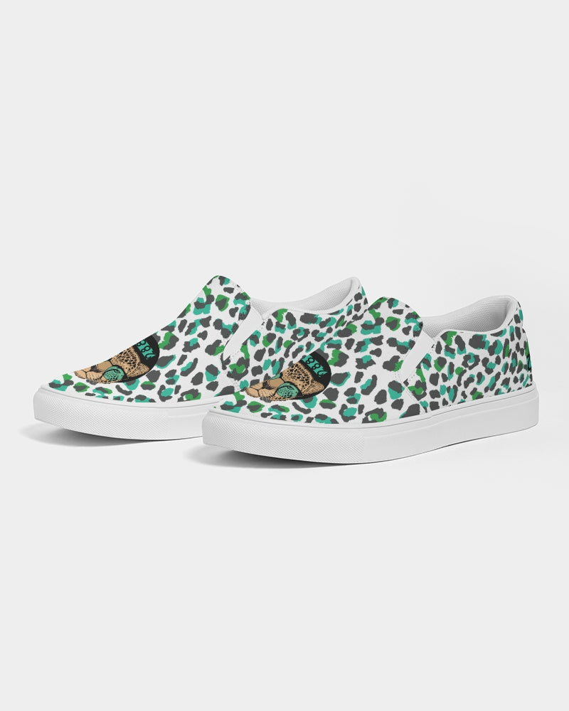 2882Sport™ Tropics of Oz Men's Cheetah Slip-On Canvas Shoes featuring a vibrant cheetah print and Shady Lion graphic.