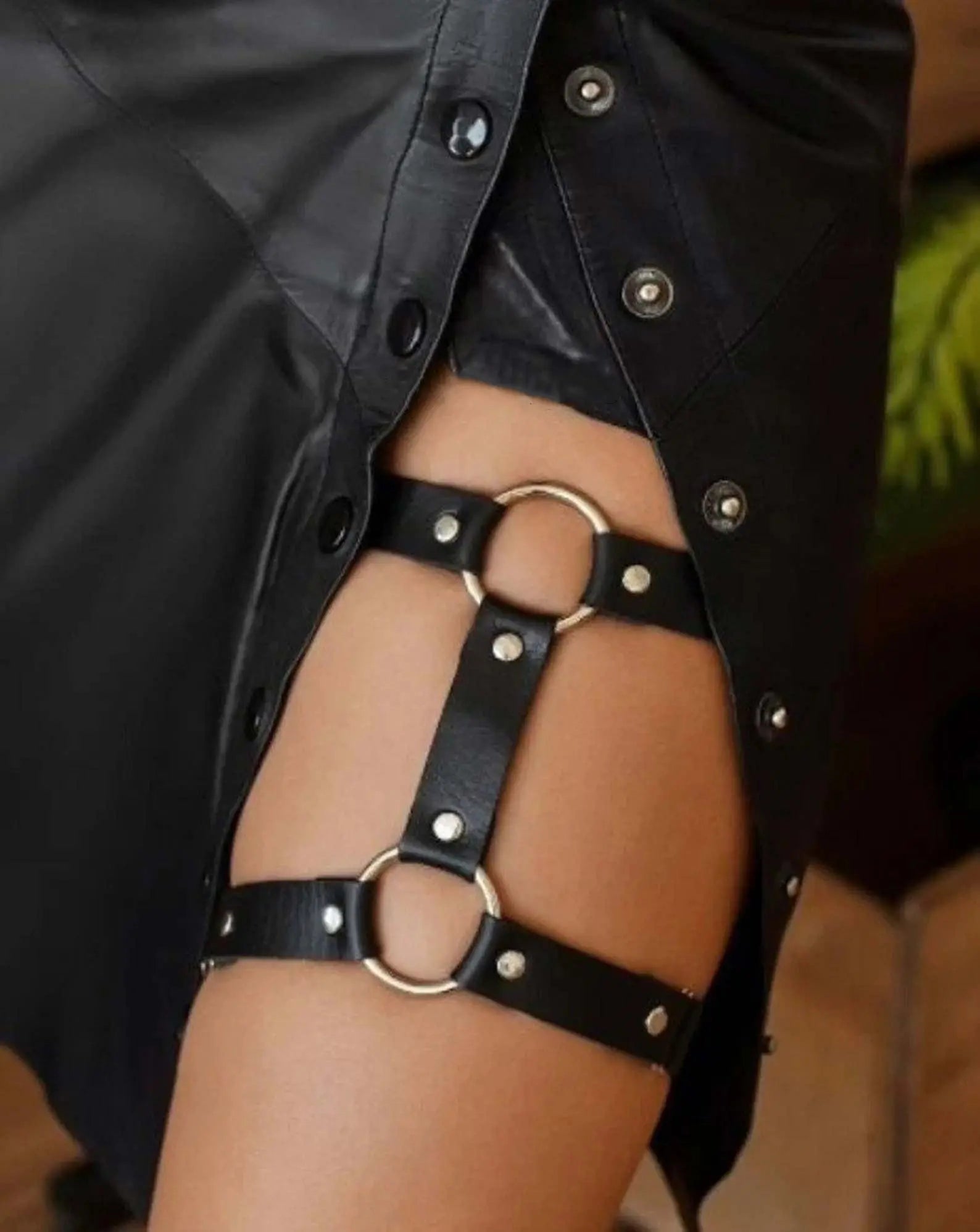 Two pieces of black leather Gothic garters leg rings designed for stylish outfits.