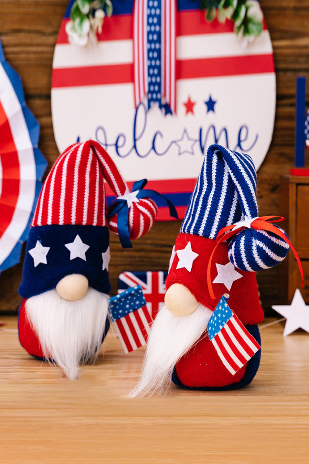 Two festive Independence Day knit gnomes, featuring vibrant colors and playful designs, perfect for holiday decor.