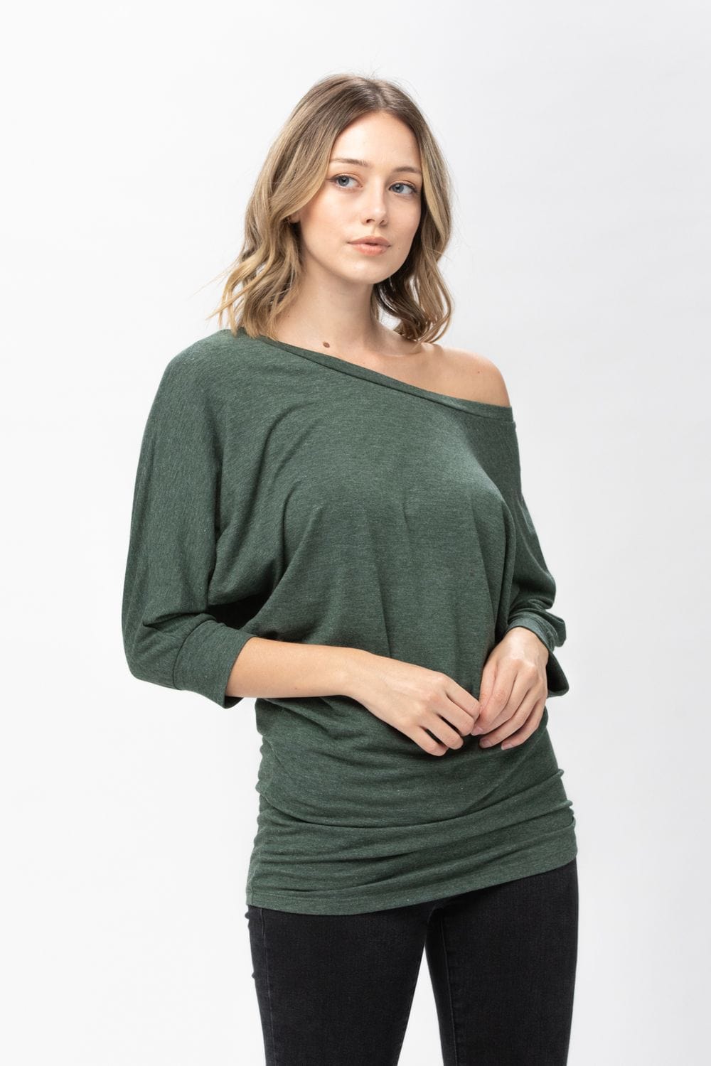 A stylish 3/4 dolman batwing sleeve tunic in a soft fabric, featuring a round neck and a loose fit, perfect for casual wear.