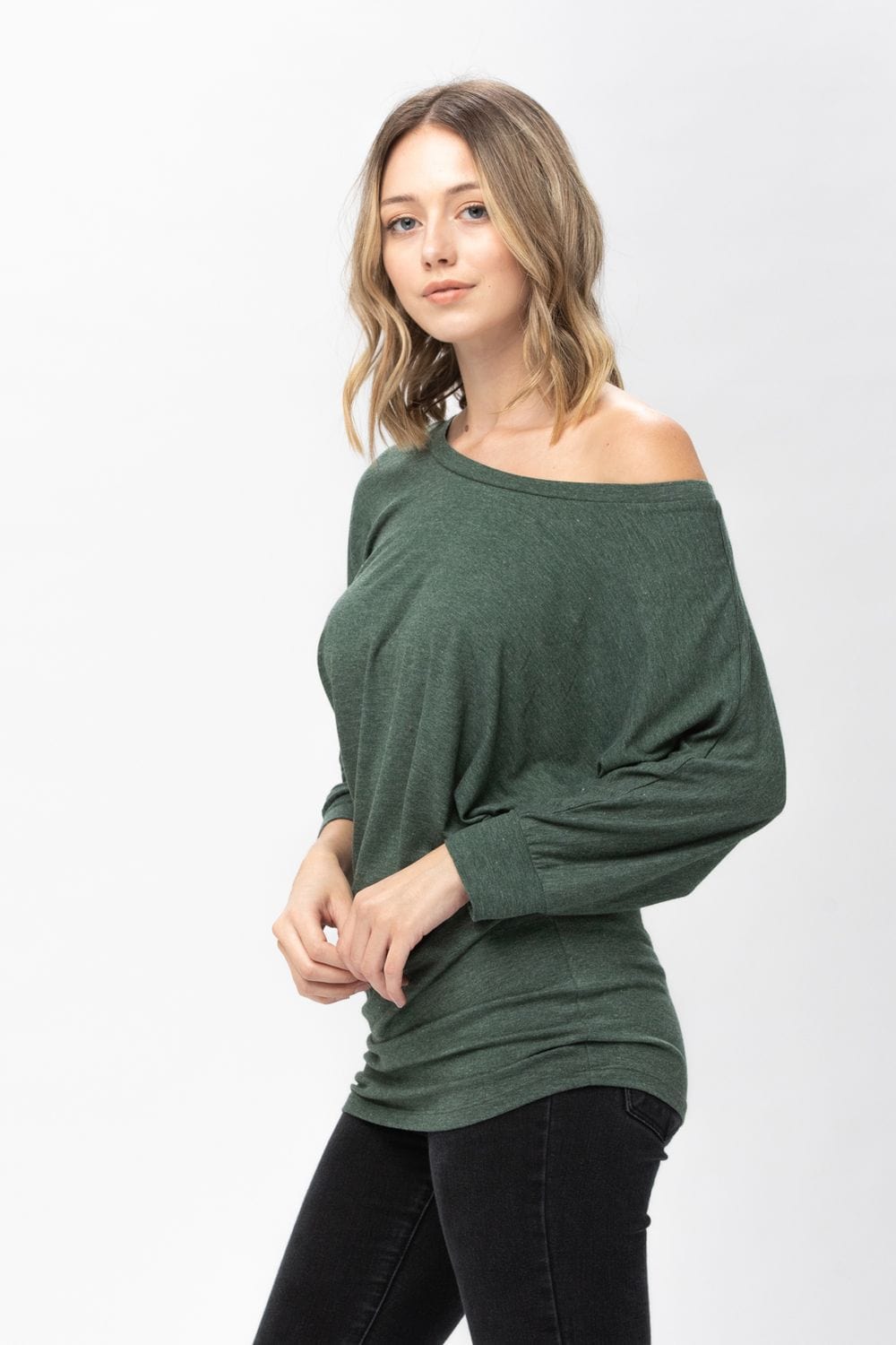 A stylish 3/4 dolman batwing sleeve tunic in a soft fabric, featuring a round neck and a loose fit, perfect for casual wear.