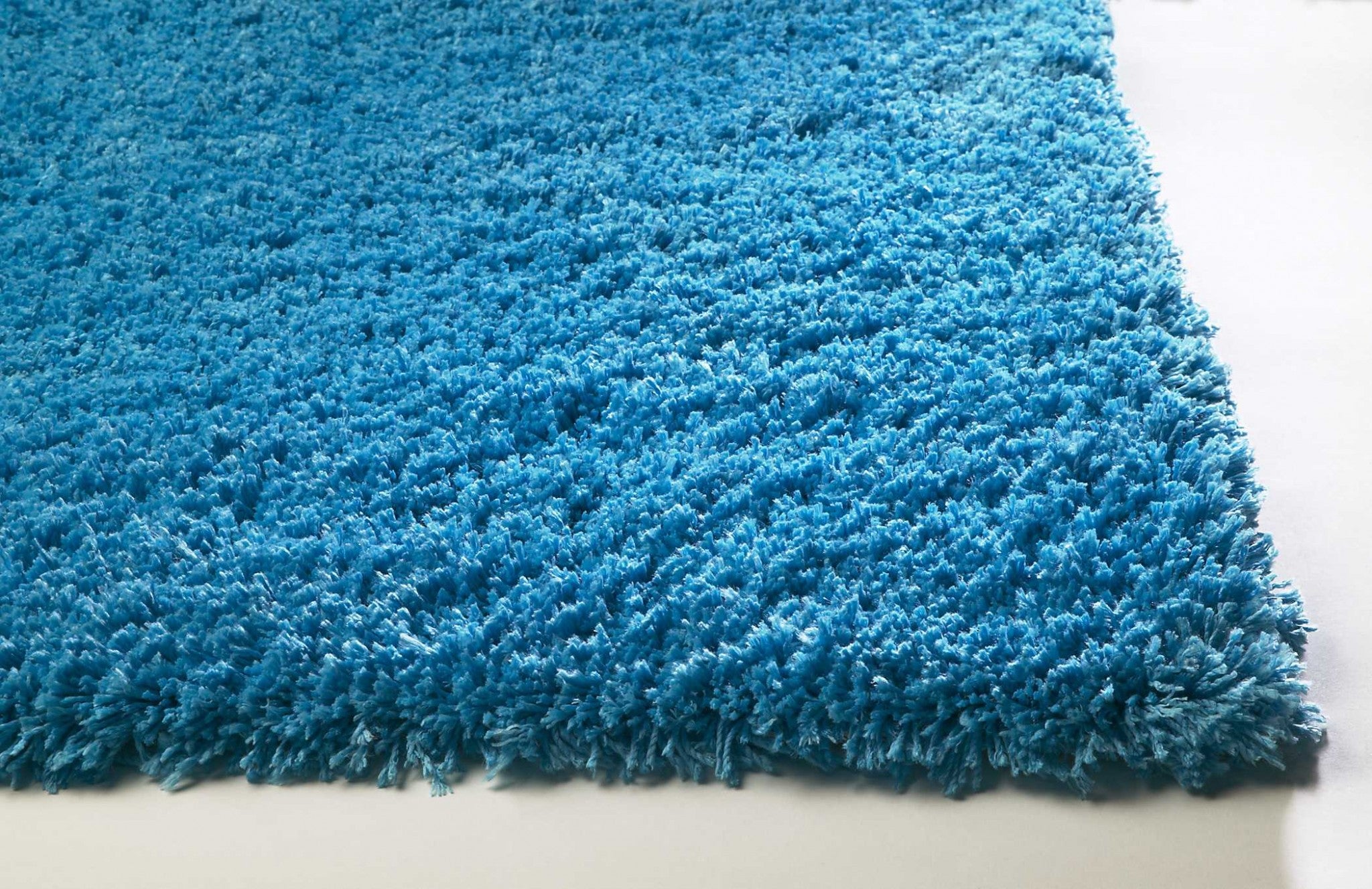 5x7 inches highlighter blue plain indoor area rug, hand woven with a soft texture and cotton backing, ideal for modern home decor.