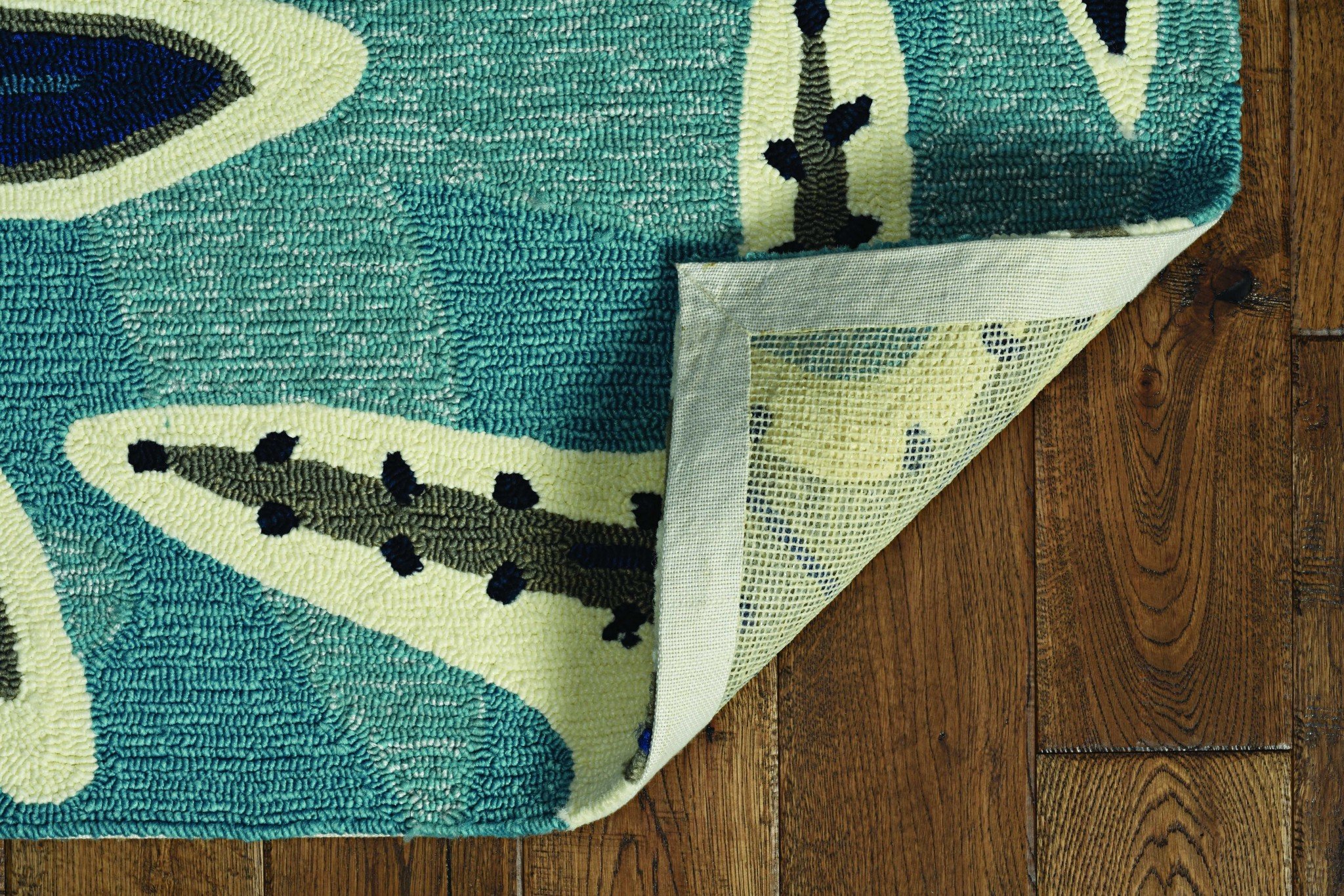 A stylish 66 x 66 ivory blue polyester rug, hand-tufted with a contemporary design, perfect for enhancing living room decor.