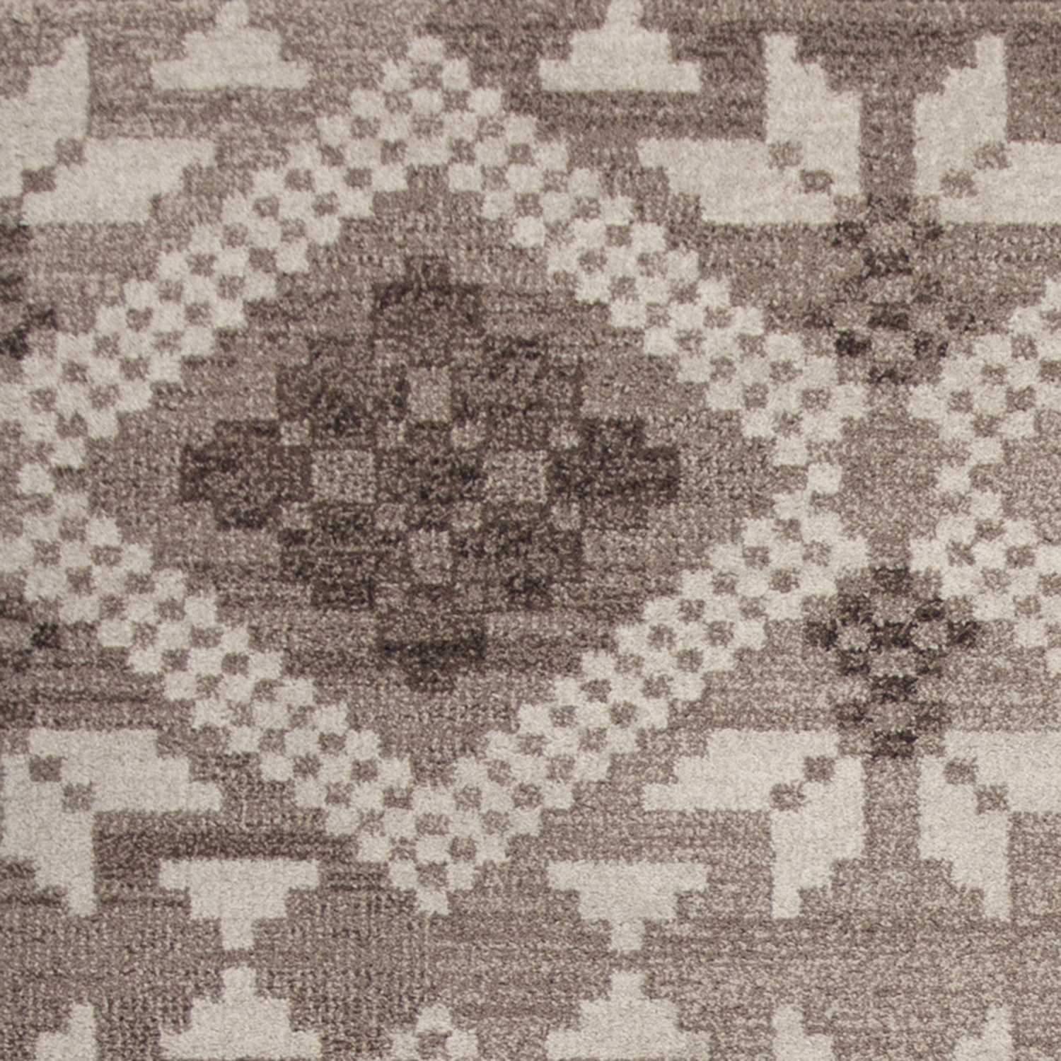7' x 11' taupe polypropylene area rug with bohemian design, showcasing its soft texture and elegant color.