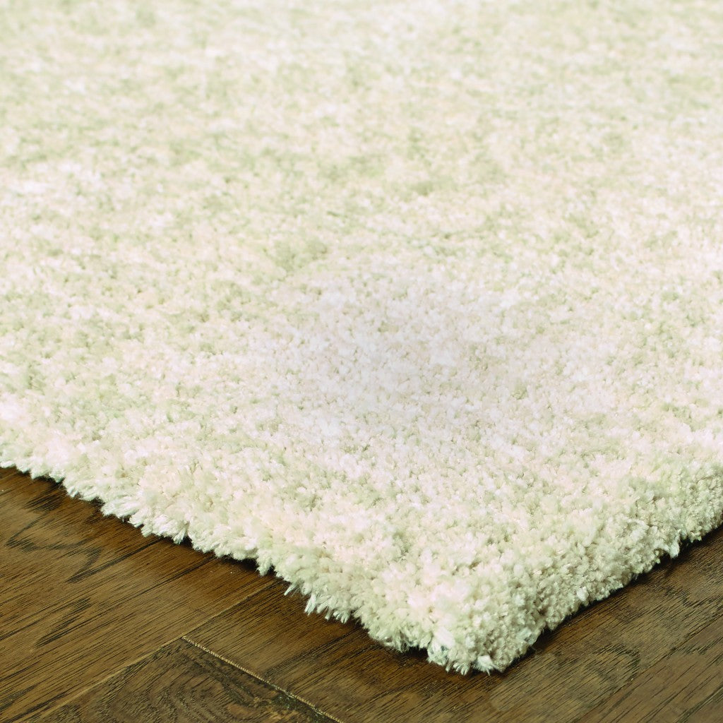A luxurious 7x10 modern shag ivory indoor area rug with a soft, dense pile surface, perfect for enhancing contemporary living spaces.