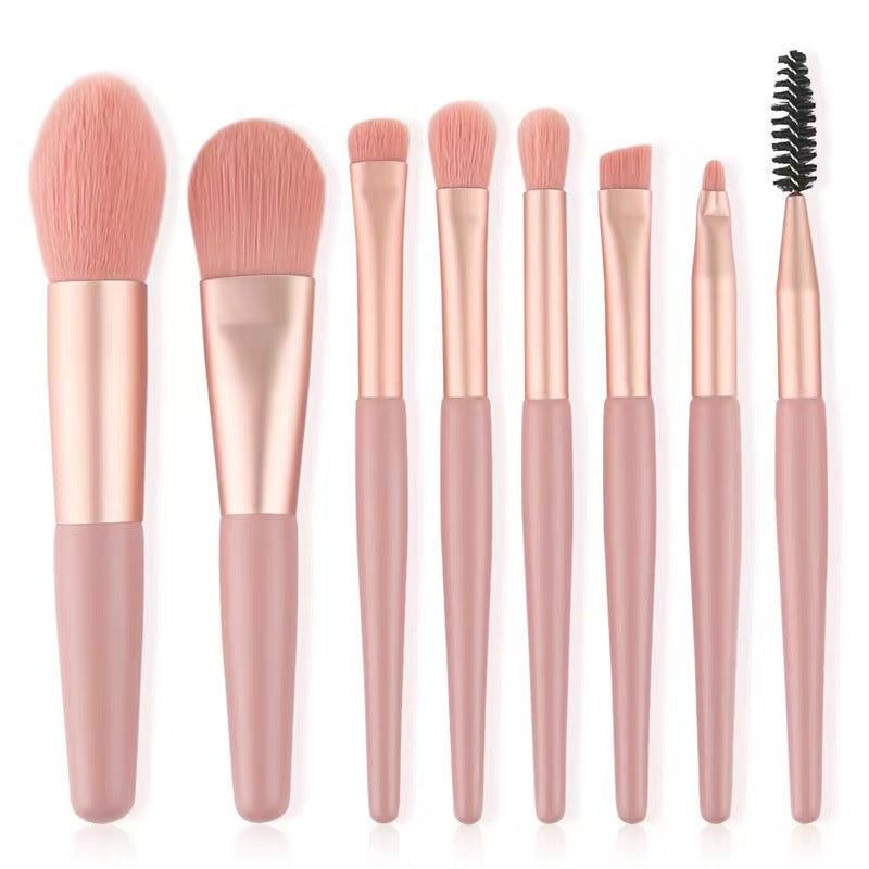 8-piece portable makeup brush set with soft nylon bristles, ideal for travel and makeup application.