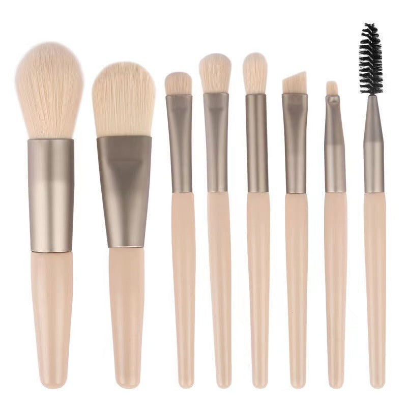 8-piece portable makeup brush set with soft nylon bristles, ideal for travel and makeup application.