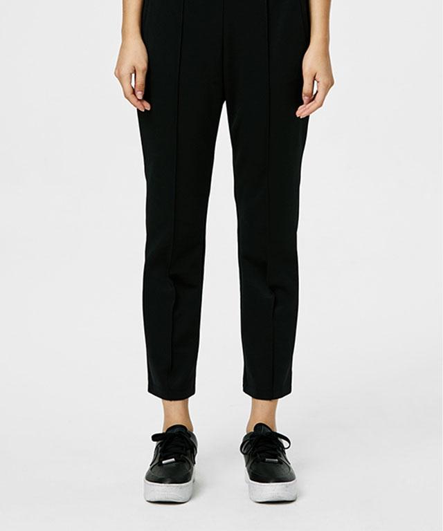 A pair of stylish 9 to 9 Pants designed for comfort and versatility, suitable for travel and casual outings.