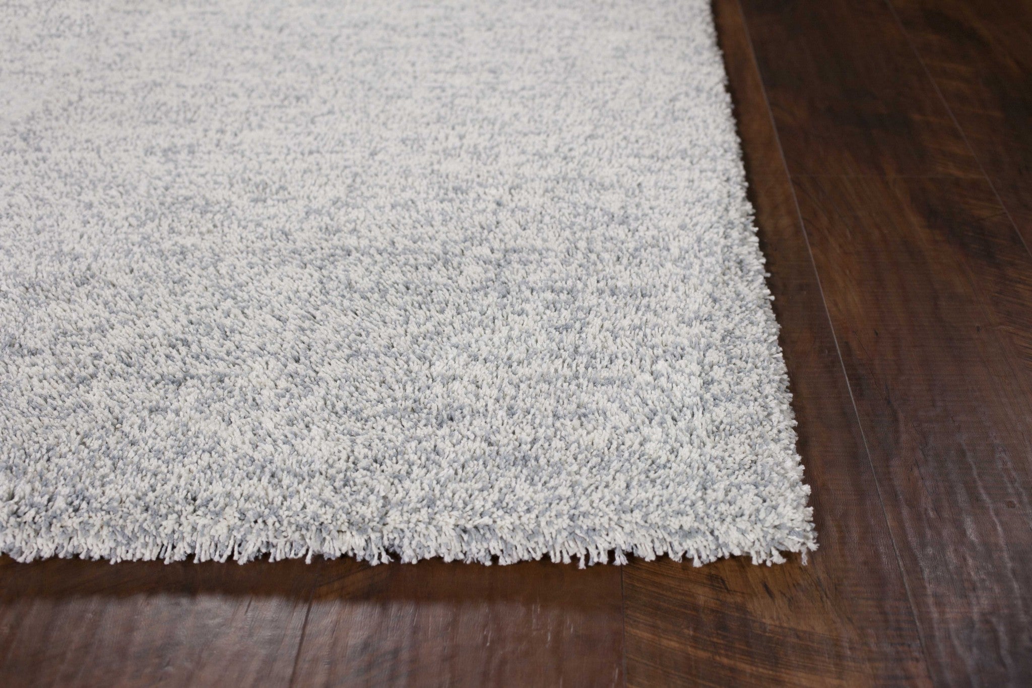 9' x 13' Polyester Slate Heather Area Rug showcasing a light blue slate heather design, hand woven with a soft texture and cotton backing.