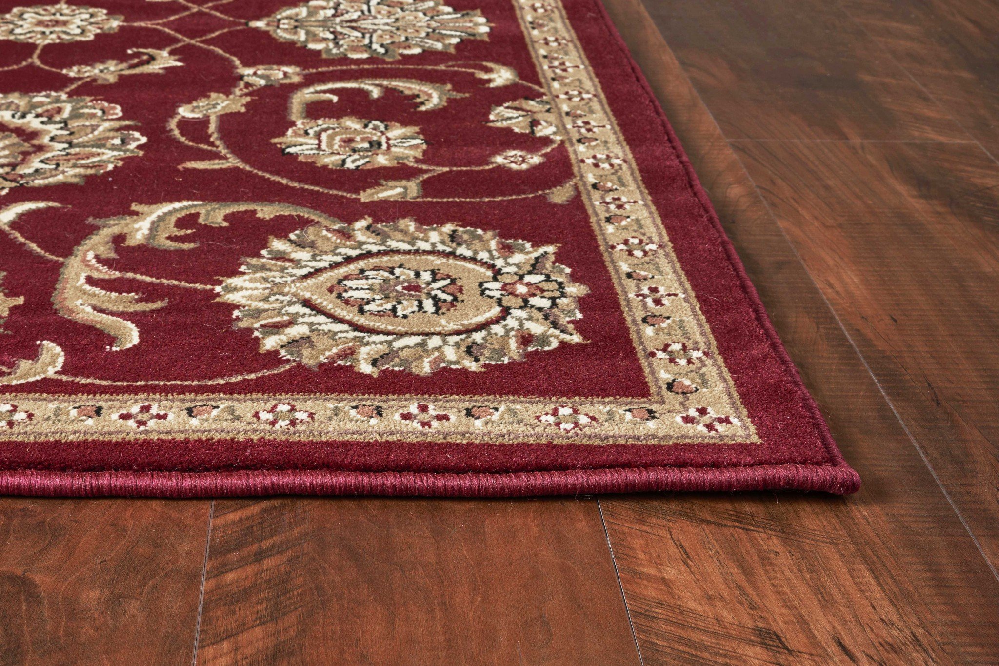 A vibrant 9' x 13' red polypropylene area rug featuring an intricate allover mahal design, perfect for enhancing home decor.