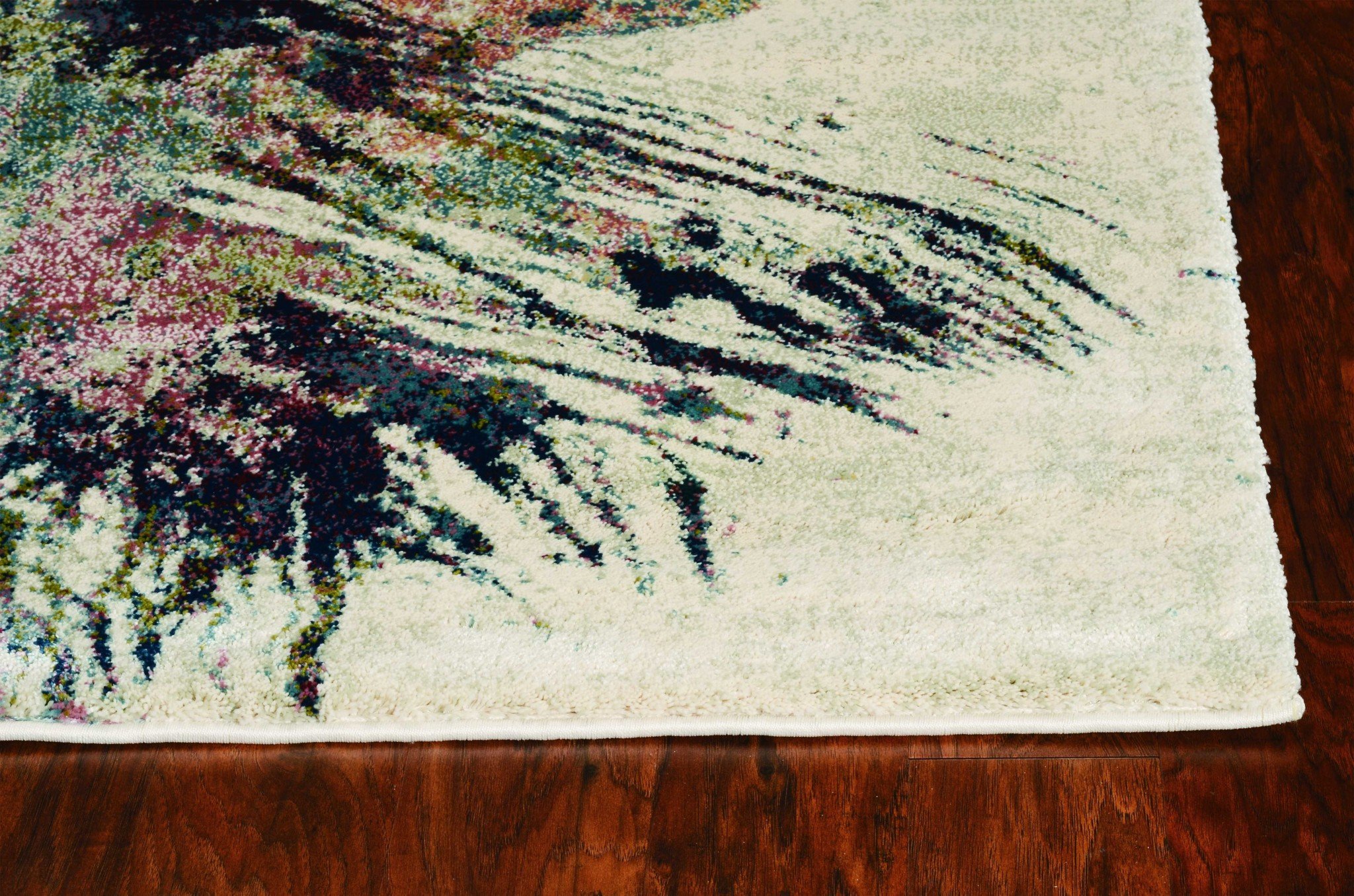 A large 94" x 134" seafoam polypropylene rug featuring a vintage traditional design with distressed touches, perfect for home decor.