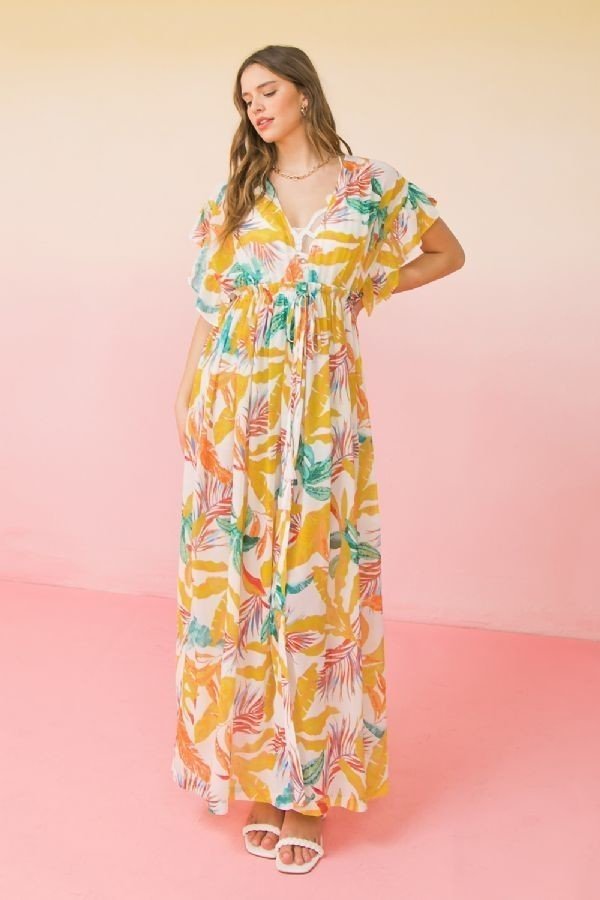 A stylish ivory printed woven maxi cover up with ruffled sleeves and an open front design, perfect for beachwear.