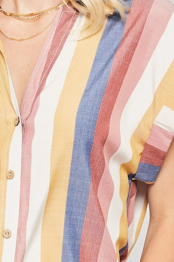 A vibrant multicolor striped woven shirt featuring a collared neckline, button-front closure with wood buttons, and short cuffed kimono sleeves.