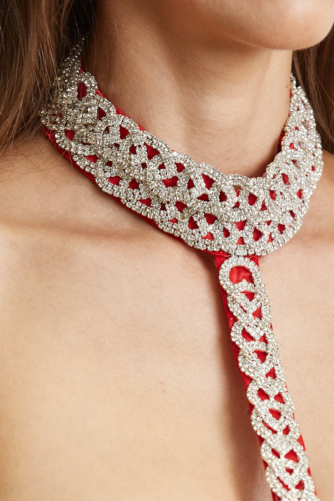 Aberdeen Top and Skirt Set featuring luxe satin fabric, rhinestone embellished mockneck, and pleated skirt with front leg slit.