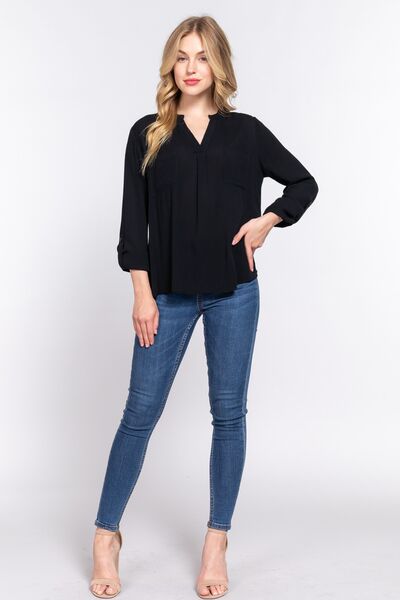 ACTIVE BASIC Full Size Notched Long Sleeve Woven Top featuring a stylish notched neckline and long sleeves, made from lightweight rayon fabric.