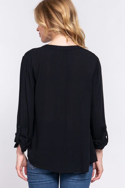 ACTIVE BASIC Full Size Notched Long Sleeve Woven Top featuring a stylish notched neckline and long sleeves, made from lightweight rayon fabric.