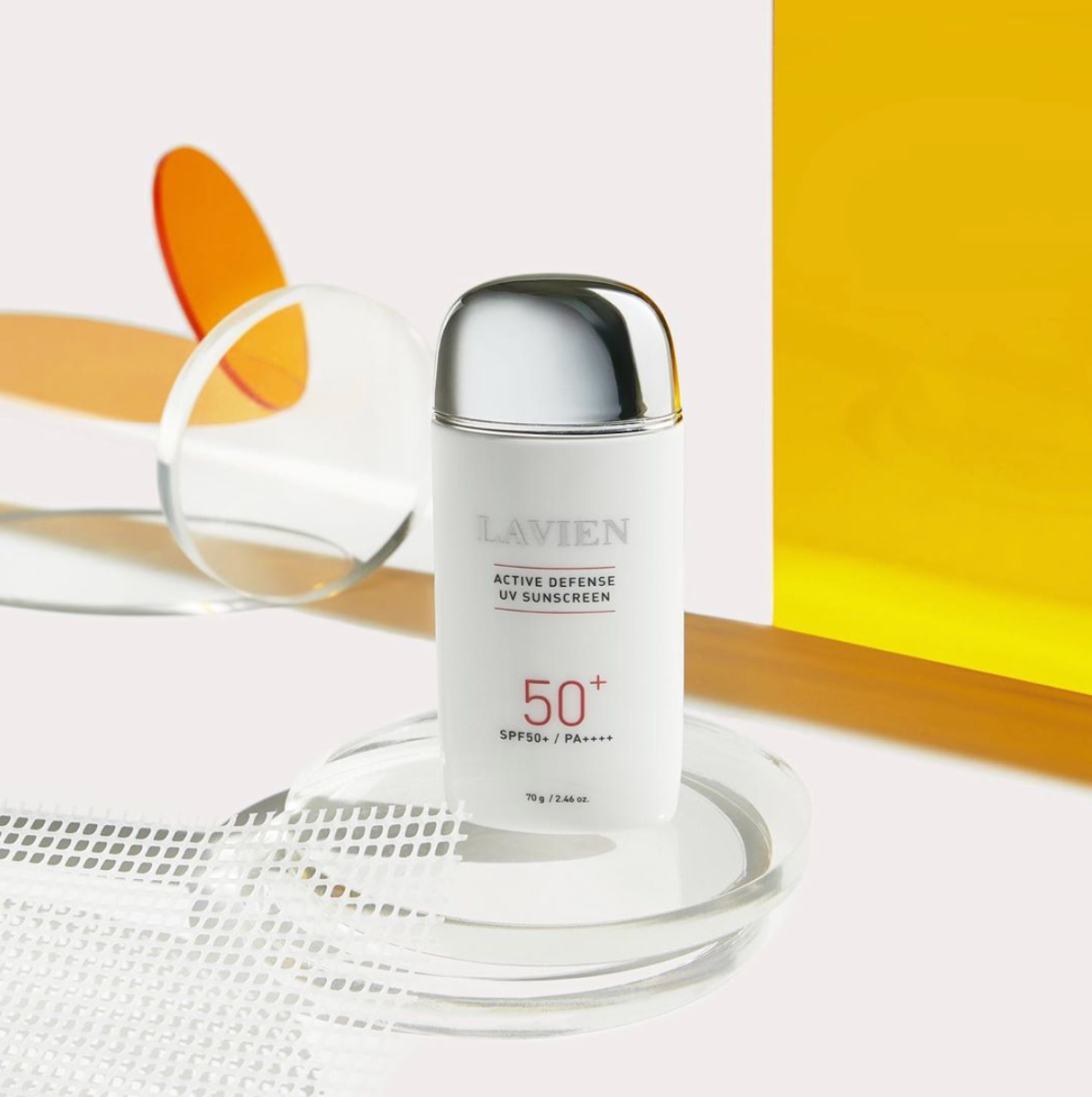 Active Defense UV Sunscreen bottle with SPF50+/PA++++ label, showcasing its whitening and wrinkle protection features.