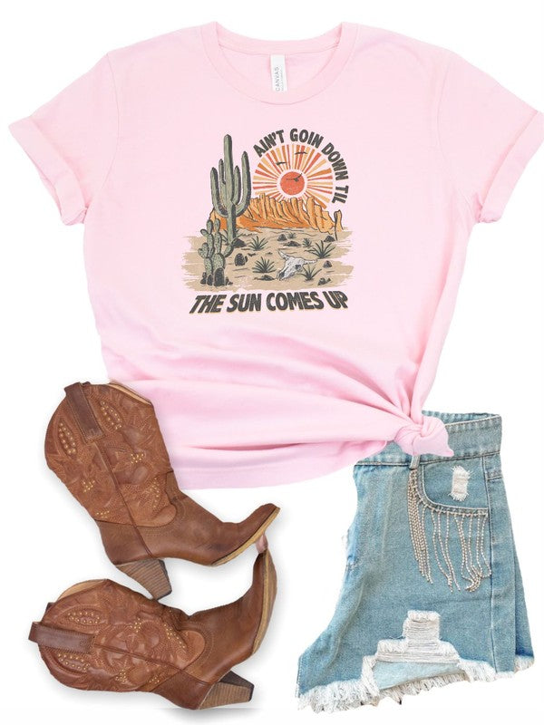A stylish unisex graphic tee featuring the phrase 'Ain't Going Down Till The Sun Comes Up', perfect for country concerts and festivals.