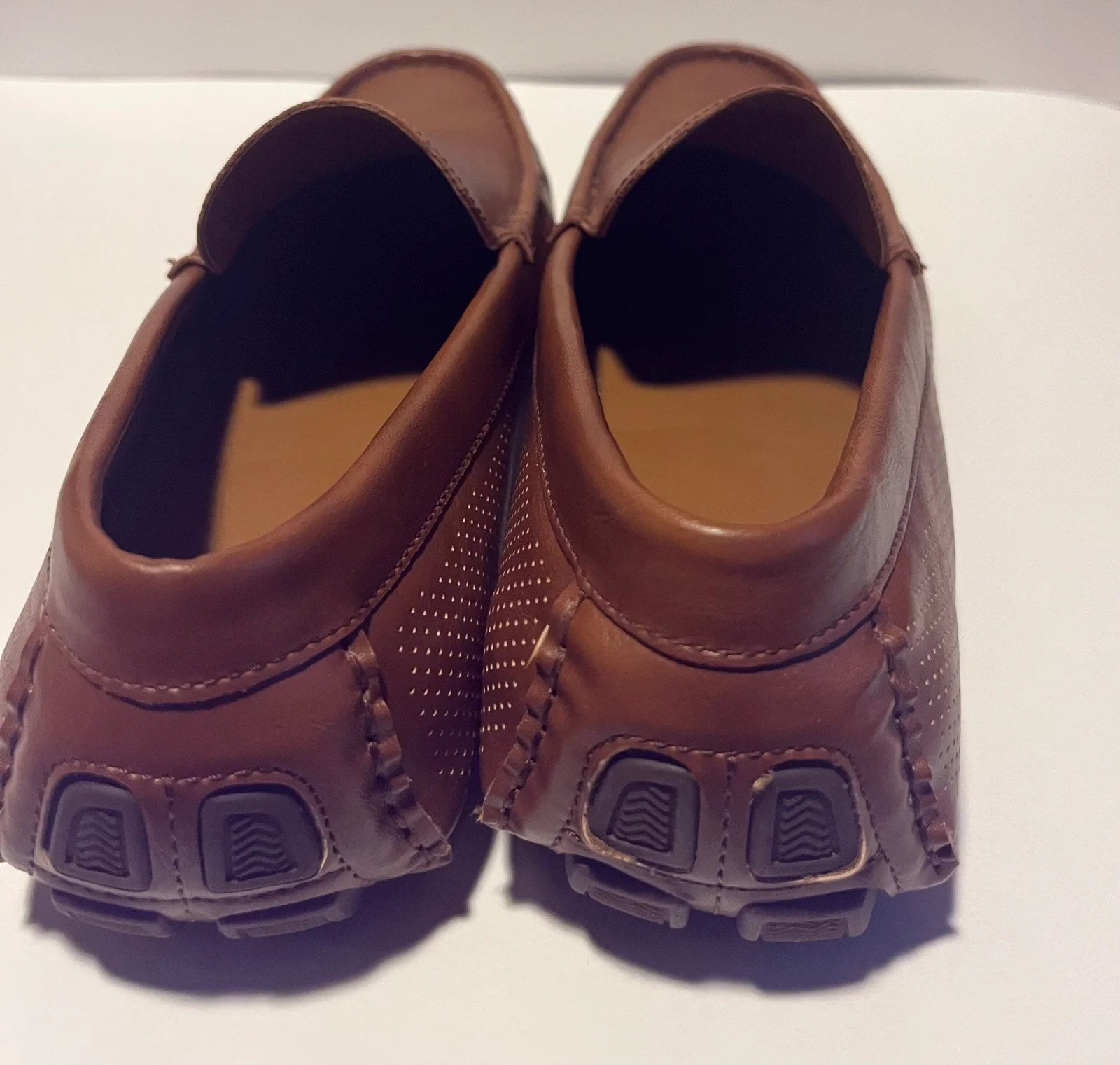 A pair of stylish Aldo Comfortable Men's Loafers made from genuine leather, featuring a moc toe design and cushioned insole.