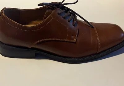 Alfani Men's Andrew Plain Toe Derbys showcasing sleek lace-up design and padded collar, perfect for work or formal occasions.