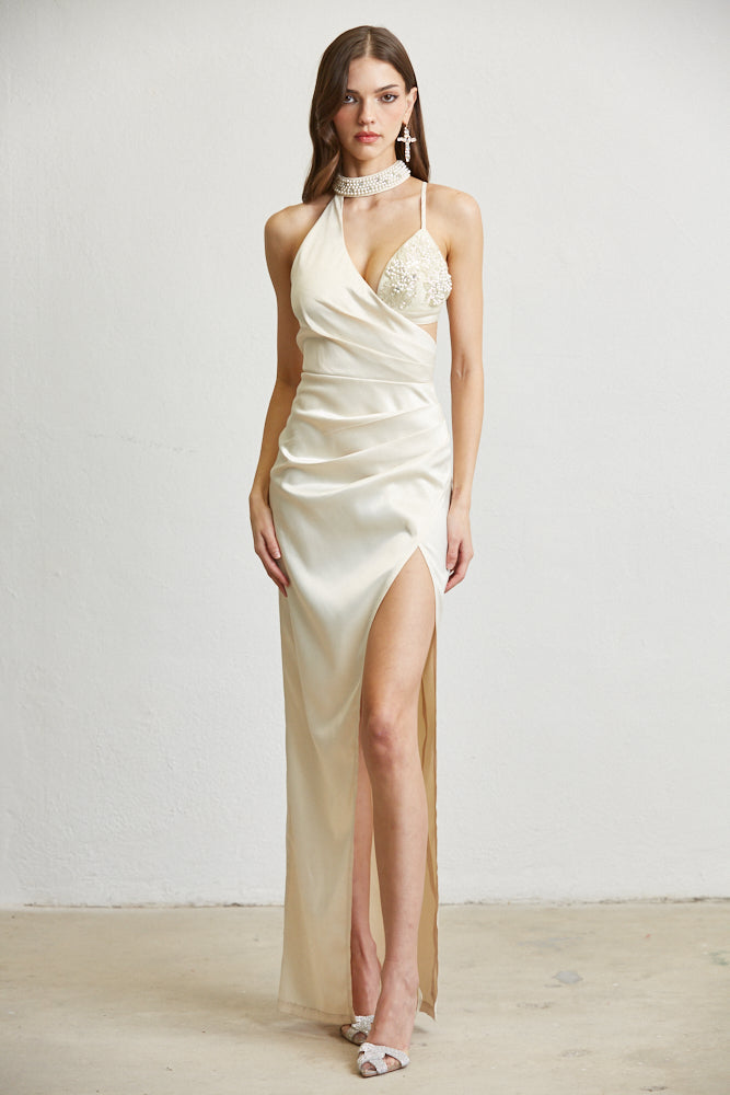 The Alina dress featuring luxe satin fabric, mockneck with beaded detailing, and a plunging bustline, elegantly ruched throughout.