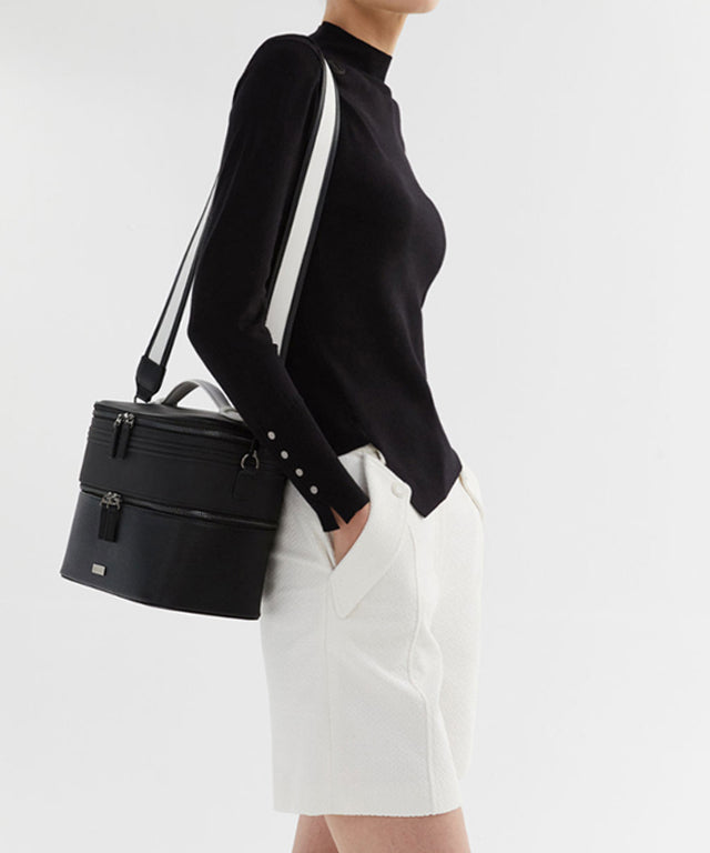 Anell Golf Classic Slim Knit Top in Black featuring a turtleneck and diagonal design details.