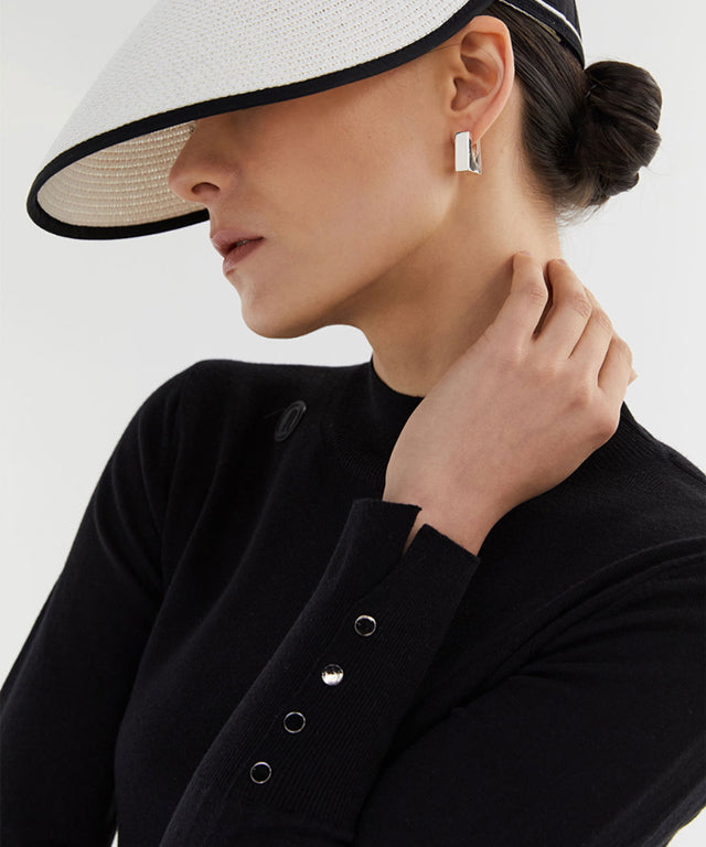 Anell Golf Classic Slim Knit Top in Black featuring a turtleneck and diagonal design details.