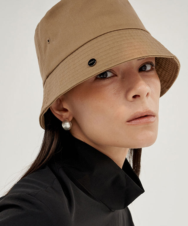 Anell Golf Cotton Classic Bucket Hat in Sand Beige, showcasing its classic design and comfortable fit.