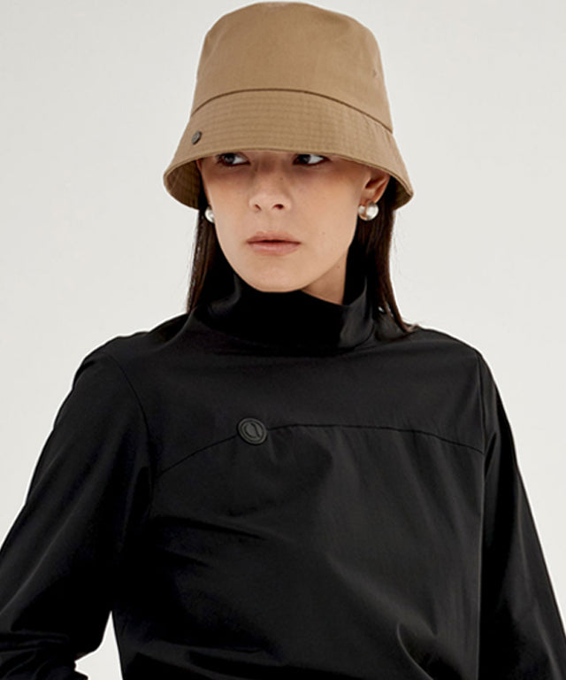 Anell Golf Cotton Classic Bucket Hat in Sand Beige, showcasing its classic design and comfortable fit.