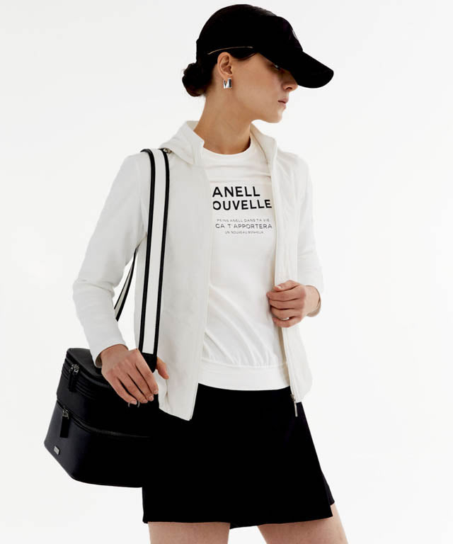 Anell Golf Cotton Wrap Skirt Pants in Black, showcasing a stylish semi-A-line design with a diagonal slit for a flattering fit.