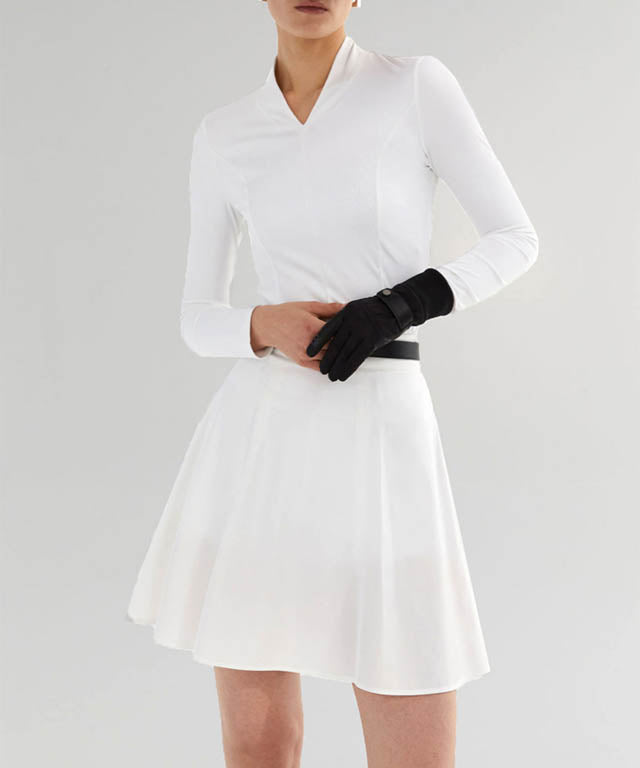 Anell Golf Slim Fit Full Skirt in White, showcasing its voluminous flare and stylish design.