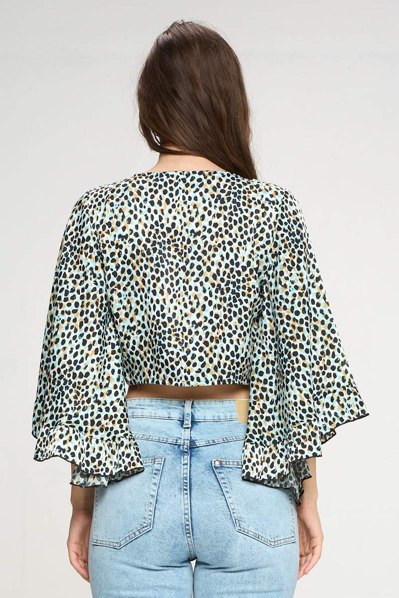 Wide ruffle sleeves tie front crop cardigan in leopard satin, showcasing its stylish design and luxurious fabric.