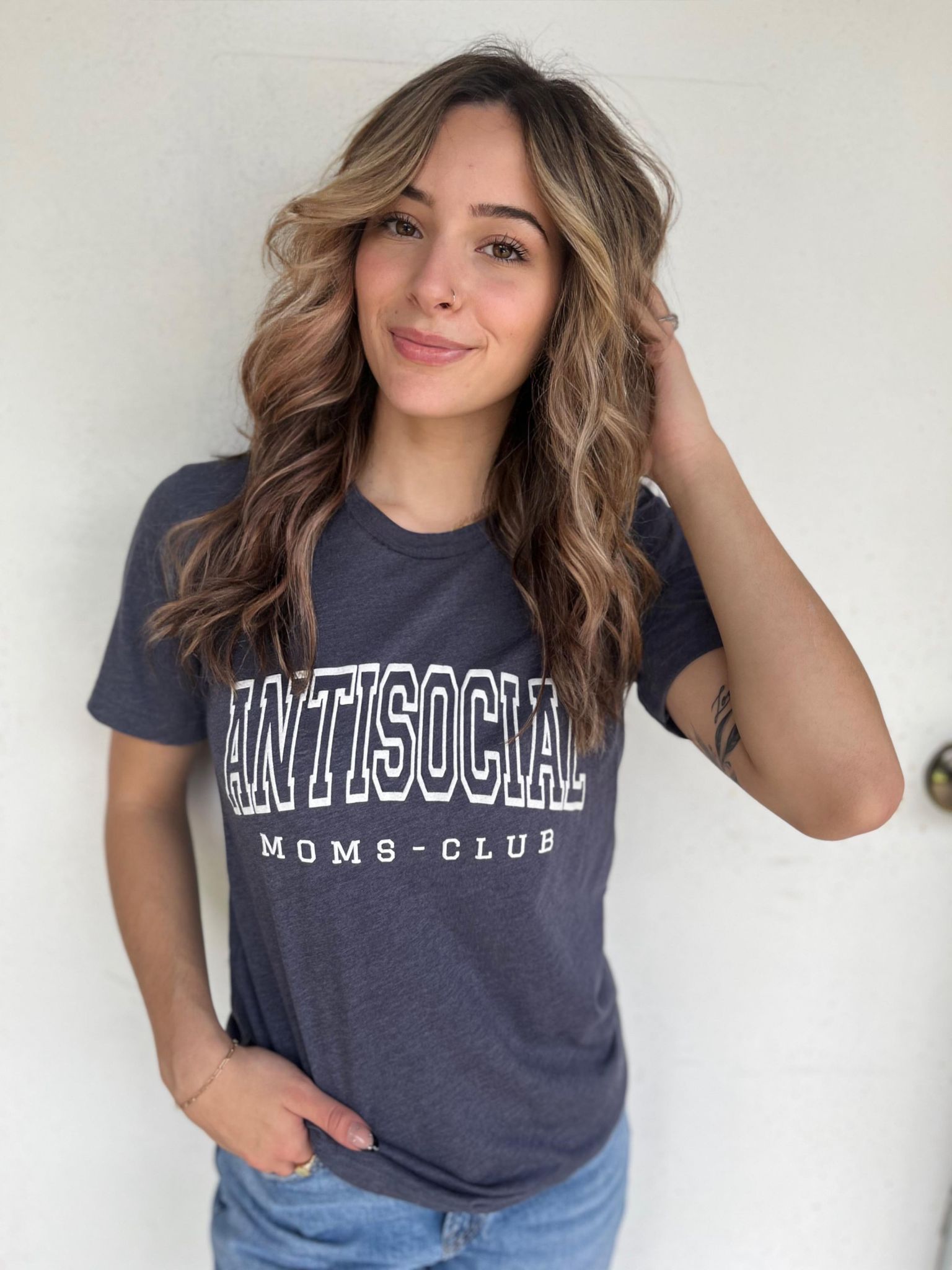 Heather navy Antisocial Moms Club T-shirt with white screen print design, made by BELLA+Canvas.