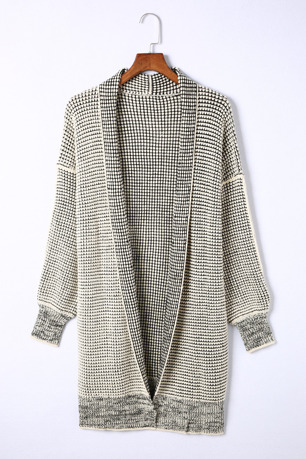 Apricot plaid knitted long open front cardigan displayed on a mannequin, showcasing its stylish design and comfortable fit.