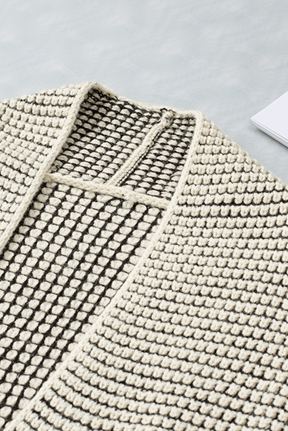 Apricot plaid knitted long open front cardigan displayed on a mannequin, showcasing its stylish design and comfortable fit.