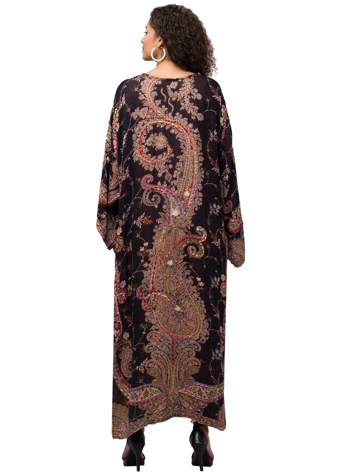 Woman wearing a patterned kaftan.