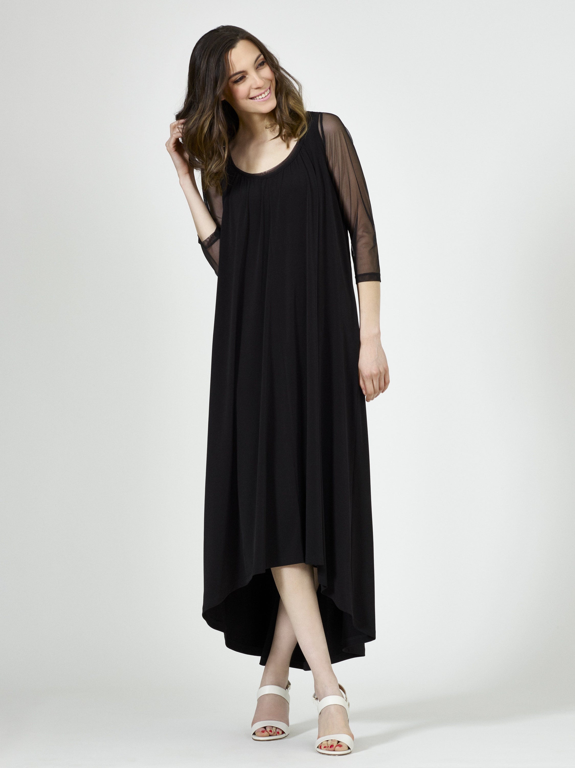 Black Fine Mesh Arm Cover, a stylish layering piece for women, showcasing its versatility and elegant design.