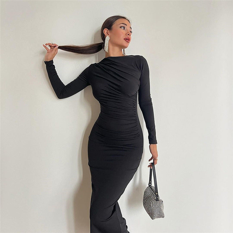 A stylish Autumn Winter women's dress featuring a round neck, long sleeves, and a slim fit design in solid color, perfect for daily wear.