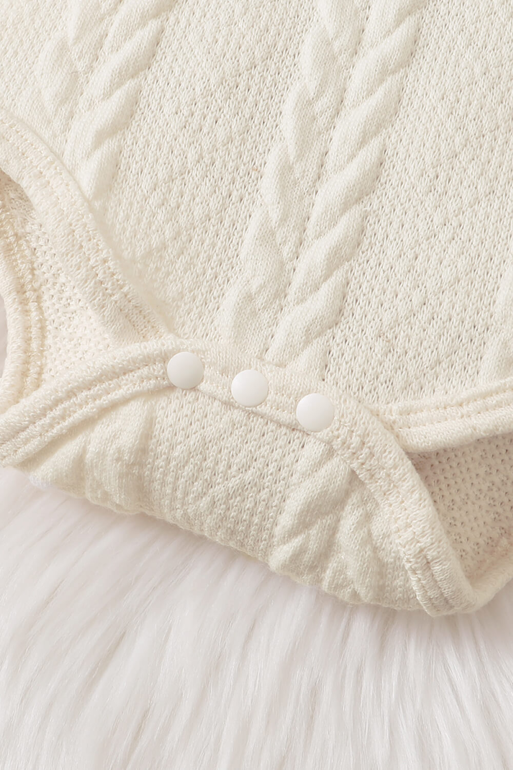 Baby girl wearing a letter graphic sweater and leopard print skirt, showcasing a stylish and comfortable outfit for infants.