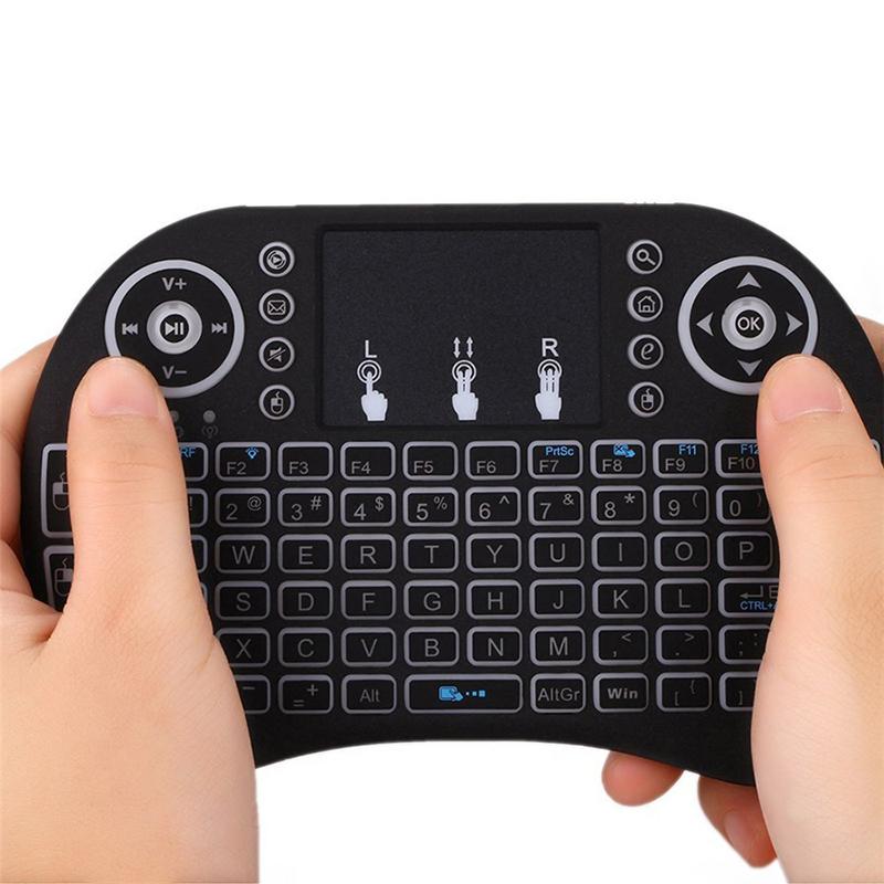Backlit i8 Mini Wireless Keyboard with French layout, featuring illuminated keys and compact design for easy portability.