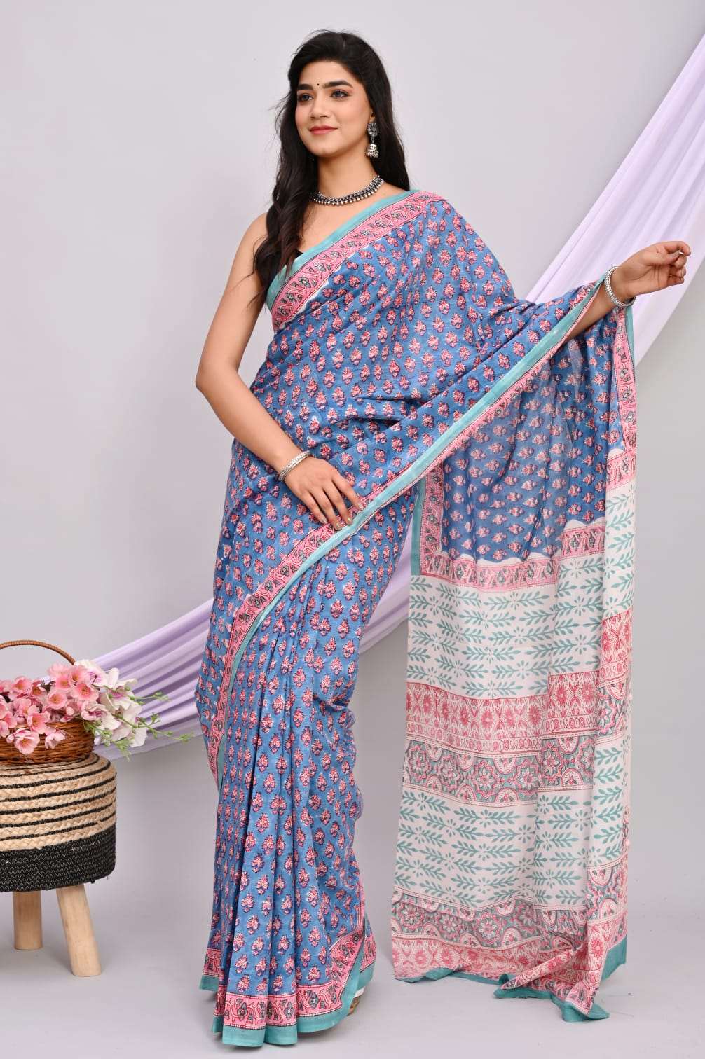 A beautiful Bagru hand block printed Kota Doria saree showcasing intricate patterns and vibrant colors, draped elegantly.