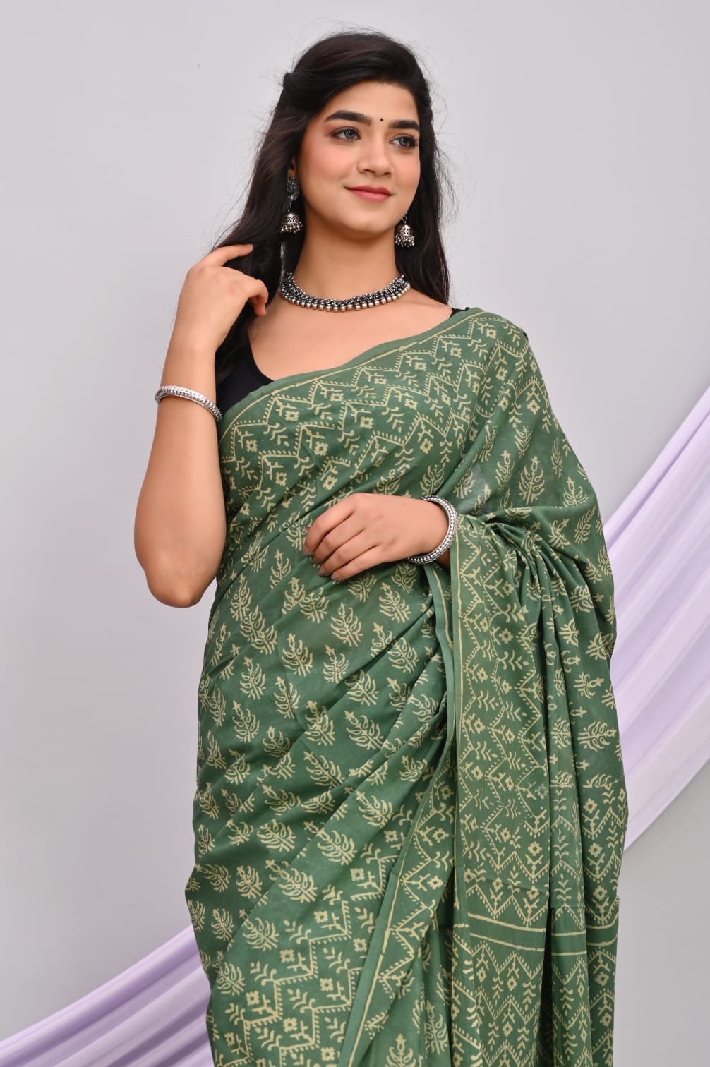 A beautiful Bagru hand block printed Kota Doria saree showcasing intricate patterns and vibrant colors, draped elegantly.