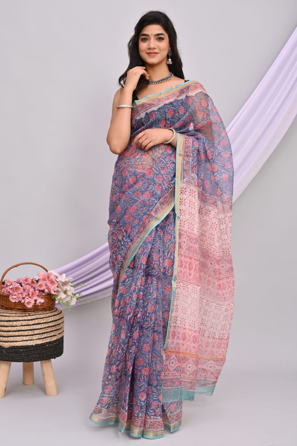 A beautiful Bagru hand block printed Kota Doria saree showcasing intricate patterns and vibrant colors, draped elegantly.
