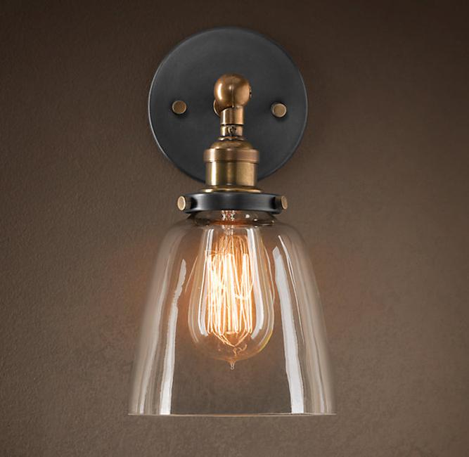 Barbara 1-light Edison wall lamp featuring a clear glass shade and bronze metal fixture, ideal for contemporary home decor.