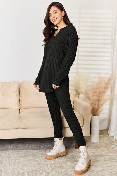 Basic Bae Full Size Notched Long Sleeve Top and Pants Set displayed on a mannequin, showcasing its stylish design and comfortable fit.