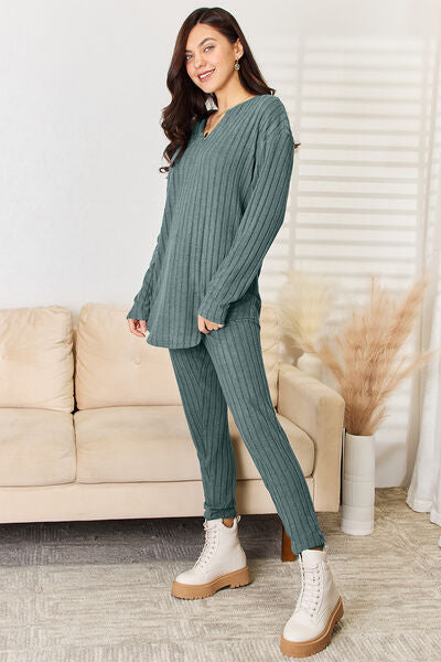 Basic Bae Full Size Notched Long Sleeve Top and Pants Set displayed on a mannequin, showcasing its stylish design and comfortable fit.
